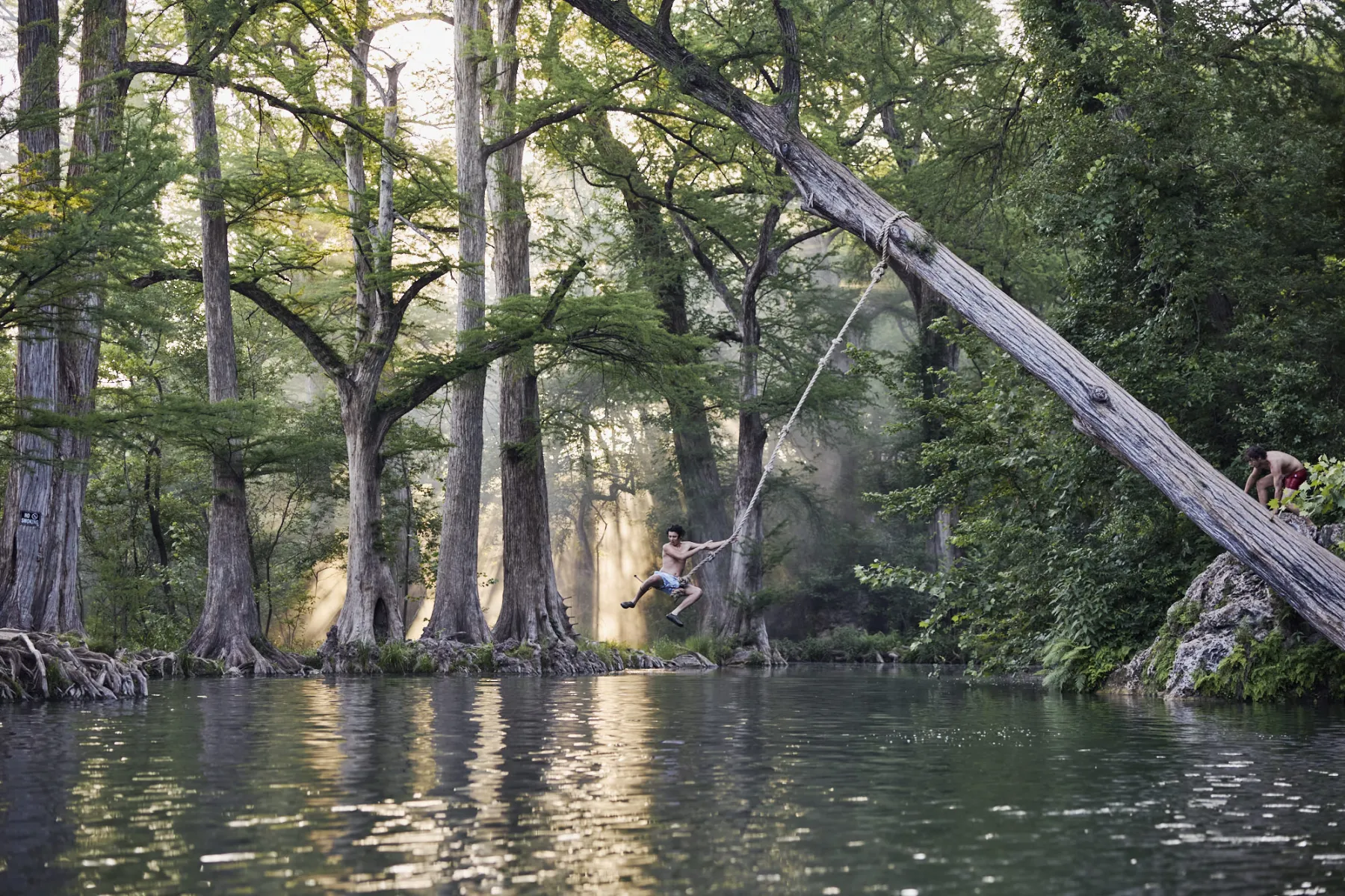 A swimming hole with a rope swing