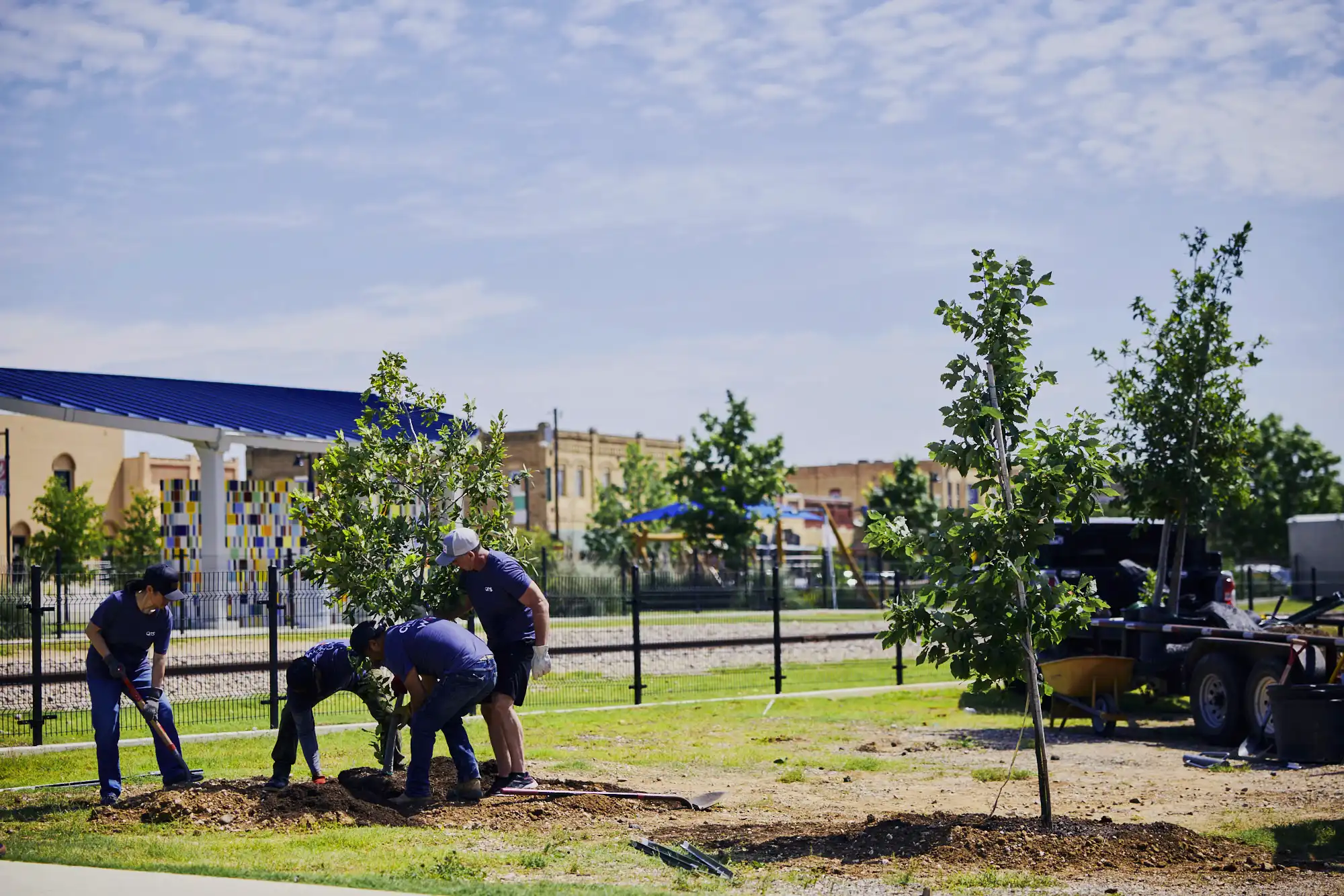 QTS employees volunteer to plant trees in a community park
